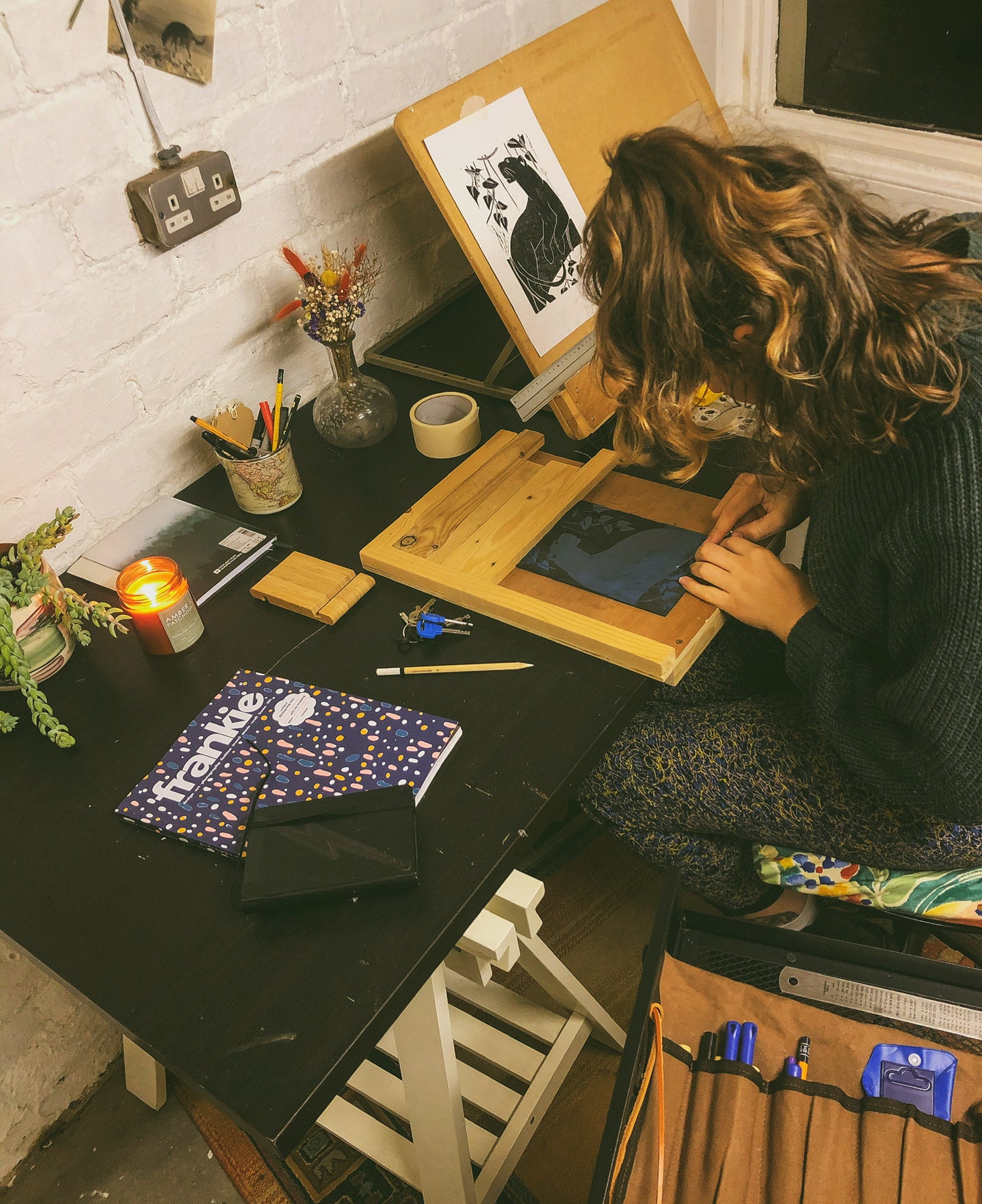 Lucy cutting a lino block in her studio